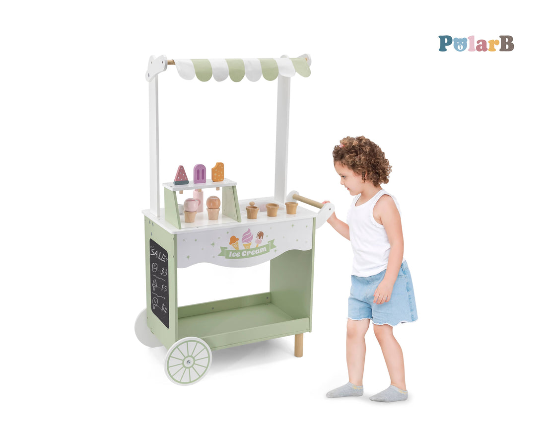 Jumbo Wooden Ice Cream Cart Stall Play Set by PolarB, featuring a pastel green and white design with toy ice cream cones and popsicles. Ideal for pretend play for kids aged 3+.